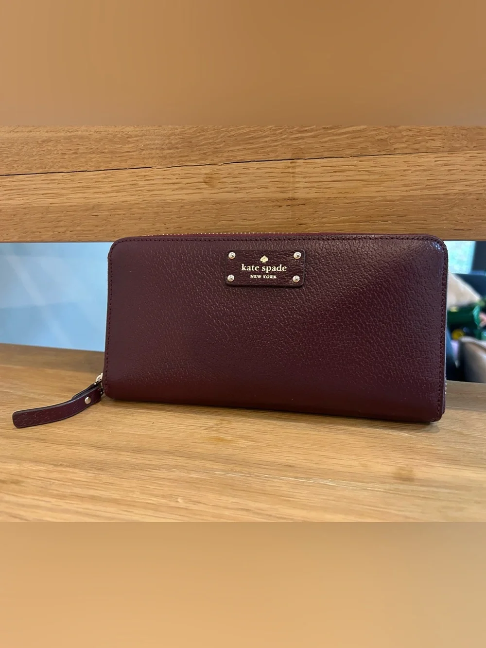 NWOT Kate Spade burgundy zip-around pebbled leather wallet